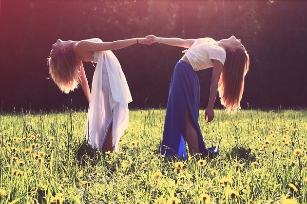 Two girls in a sunny field