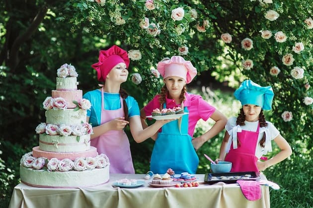 Children serving cakes