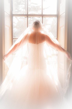 Wedding dress at window