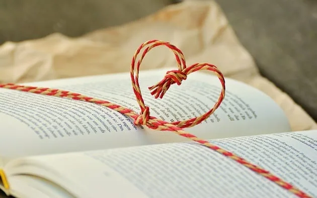 An open book with a heart